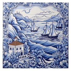 a blue and white tile with boats on the water in front of an ocean scene