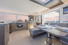 a kitchen and dining area in a boat