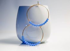 Blue Hoop earrings These classic large gold hoops earrings are lightweight for everyday wear. 14k gold filled big & bold hoops. Simple and thin 14k gold filled wire hoops. These hoops are 2 inches in length and width Made with Blue mini Crystals and wire Gold fill. All of my work is handmade in my studio, each piece is a unique design and one of a kind gift. If you wish to make a gift, select the option and the gift option and it will be sent to you in a white cardboard gift box with a ribbon. Y Blue Hoop Earrings, For Mom, Hoop Earrings Large, Greek Blue, Dainty Hoop Earrings, Gold Filled Hoops, Hoop Earrings Gold, Crystal Hoop Earrings, Earrings Christmas