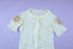 "Prairie Cottage Core Embroidered Flowers 1970's Vintage Blouse, size 42, please see measurements. Great condition. Measurements: (Please note measurements are taken flat, across the surface. Best to compare to a garment you already own that fits to your liking). Pit to Pit: 19.5\" Collar to bottom: 20.5\" I do my best to describe all items accurately. All items are sold in As-Is condition. Please keep in mind these are used vintage pieces so there will be age-appropriate wear unless noted deadstock. Feel free to contact me if you have any questions! No refund, no returns." Retro Floral Embroidered Summer Tops, Retro Summer Tops With Floral Embroidery, Retro Embroidered Summer Tops, Vintage Embroidered Cotton Tops, Fitted 1970s Style Summer Blouse, Vintage Floral Embroidery Spring Tops, Vintage Floral Embroidery Tops For Spring, Fitted Blouse 1970s Style For Summer, 1970s Cotton Blouse For Spring