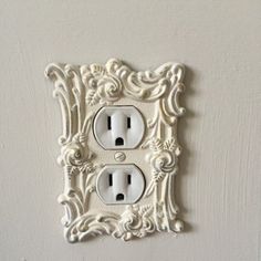 an ornate light switch plate covers the wall