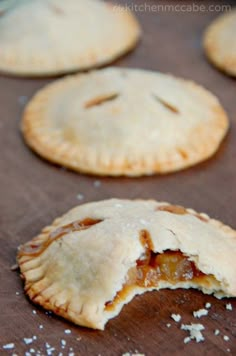 several small pies are sitting on a table