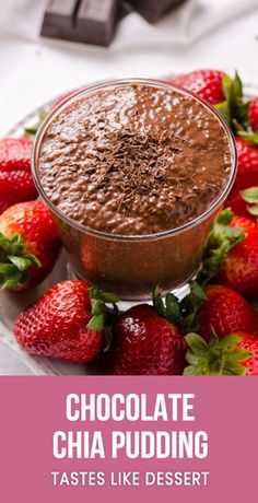 chocolate chia pudding on a plate with strawberries and chocolate bars in the background