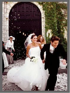 the bride and groom are throwing confetti at each other