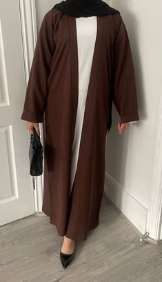 Elegant Premium Open Abaya comes in Cedar Brown. Made with Premium linen. Comes with a matching belt.  This open Abaya is part of our Dubai Collection. Please check Size Guide in the photos before placing your order. Colour may vary across devices and based on the pictures lighting. Machine washable. Available for IMMEDIATE dispatch. Brown Abaya, Abaya Design, Open Abaya, Hijab Trends, Modesty Fashion, Abaya Designs, Beauty Goals, Dress Clothes For Women, In Dubai