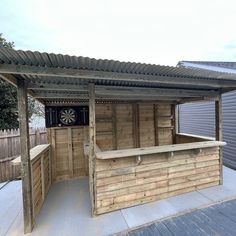 an outdoor bar made out of pallet wood