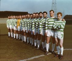 a group of men standing next to each other on a field