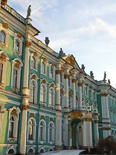 an ornate building with many windows and gold trim