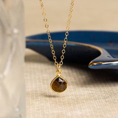 Smokey Quartz Teardrop Pendant Gemstone Gold Necklace - Birthday, Graduation Gift Handmade Jewelry for Women, Bridesmaid, Niece, Graduation Stone: Genuine Smokey Quartz Heart Gemstone: 11mm x 9mm Gold chain: 14k gold filled Chain length: 16-18 inches adjustable Clasp: spring ring Bezel: Vermeil Gold About "Gold Filled Jewelry": Also called rolled-gold. These jewelry items are not actually filled with gold. They are made of a base metal covered by sheets of gold in a mechanical bonding process... Thick Coat, Ring Bezel, Heart Gemstone, Necklace Minimalist, Teardrop Pendant, Gemstone Necklace Pendant, Chain Jewelry, Smokey Quartz, Gift Handmade