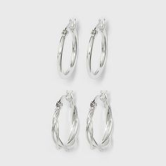 Pick up something that will never go out of fashion with the Braided and Polished Silver Plated Hoop Earring Set from A New Day™. This set includes two pairs of simple hoop earrings in classic styles you're sure to get plenty of wear out of. A pair of delicate hoops shine in a high-polish finish alongside a pair of braided hoop earrings that keep the minimalist style while adding a touch of depth to the look. These silver plated hoops are perfect for everything from sweats to swanky dresses than Simple Hoop Earrings, Silver Jewelry Earrings, Hoop Earring Sets, Silver Pieces, A New Day, Minimalist Style, Beaded Earrings, New Day, Earring Set