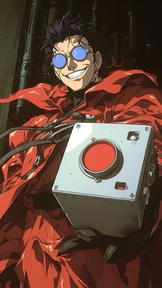 a man in red is holding a box with wires attached to it and wearing blue glasses