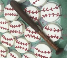 a baseball bat and some white buttons on a table