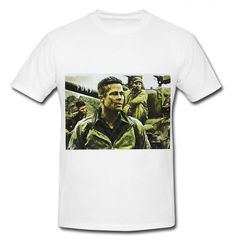 a white t - shirt with the image of a man standing in front of soldiers