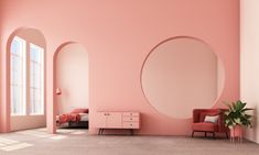 an empty room with pink walls and round mirrors on the wall next to a bed