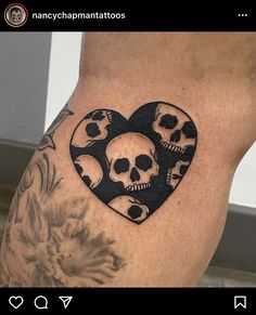 a woman's thigh with skulls in the shape of a heart