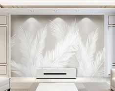 an elegant living room with white furniture and palm leaves on the wall behind the tv