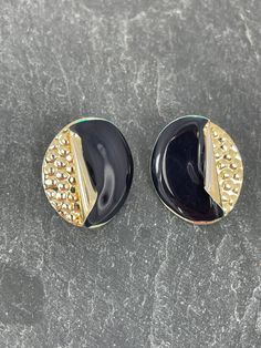 A wonderful pair of vintage earrings they are made of gold tone textured metal with a lovely detailed curve on them which is black enamel, these are unsigned so difficult to date, but would estimate around the 80's they are very light weight too these are for pierced ears, they measure 24.50 mm x 20.45 mm at the widest points. Measurements are generally taken in mm and is very accurate as taken with my vernier gauge and these are taken at the widest points unless otherwise stated. Please take a Vintage Black Enamel Earrings, Black Enamel Earrings, Pierced, Formal Gold Clip-on Earrings With Black Enamel, Vintage Gold Clip-on Earrings With Black Enamel, Black Enamel Pierced Earrings, Black Enamel Metal Earrings For Evening, Vintage Black Enamel Clip-on Earrings, Formal Black Enamel Metal Earrings, Vintage Black Metal Clip-on Earrings