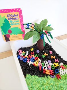 there is a cake with letters and a tree on it