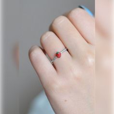 Introducing our Adjustable Strawberry Ring, a delightful accessory perfect for any occasion. Crafted with high-quality materials, this ring features a charming strawberry design and is adjustable to fit most finger sizes. Ideal as a unique gift for her, this ring adds a touch of whimsy to any outfit. Product Details: Materials: High-quality alloy, enamel Size: Adjustable to fit most finger sizes Design: Cute strawberry motif, ideal for everyday wear or special occasions Care Instructions: Avoid Cute Red Ring For Gift, Cute Red Ring As Gift, Cute Adjustable Rings For Promise, Cute Adjustable Promise Ring, Strawberry Ring, Strawberry Design, Cute Ring, Cute Strawberry, Knuckle Rings