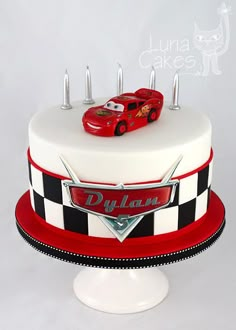 a birthday cake with cars on top