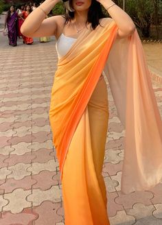 #sunset #ombresaree #orangesaree #yellowsaree #saree #farewell #farewelloutfit #outfit #indianweddings #indianfashion #indianaesthetic #sareefashion #traditionalwear #indianweddings #indianaesthetic #whiteaesthetic #orangeaesthetic #orange #yellow #ombre #georgettesaree #georgette Orange Saree Aesthetic, Graduation Sarees Ideas, Ombre Saree Chiffon, Yellow Orange Saree, Orange Georgette Saree, Yellow Saree Aesthetic, Chiffon Saree Look, Orange Girl Aesthetic, Orange Saree Look