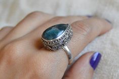 - Handmade sterling silver ring - Ornamented with silver designs - Oxidized and polished - Chrysocolla gemstone - Don't forget to note your ring size during checkout - All items are send gift wrapped - Free shipping - Tracking number is provided for all the shipping items - Please check shop policies - Thank you for your support =) Silver Sterling Silver Emerald Ring With Natural Stones, Silver Apatite Jewelry For Anniversary, Handmade Apatite Rings For Anniversary, Handmade Silver Chrysocolla Rings, Silver Chrysocolla Rings For Gift, Silver Chrysocolla Ring, Silver Stone Ring, Handmade Sterling Silver Rings, Blue Stone Ring