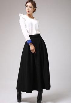 "This black wool skirt designed with pleated front and high fitted waist. Also, two hip pockets and side zip closure for more convenient wear. It is made of soft wool blend and it has lining.the lady skirt with a maxi length is really a good choice for winter. This skirt can be a basic piece in your wardrobe. Due to it classic cut and rich solid color it can be easily matches with many different styles. DETAIL * 30% wool, 30% fiber, 40% polyester * polyester lining * Seam pocket * Right zipper c Long Skirt Winter, A Line Maxi Skirt, Maxi Skirt Winter, Long Wool Skirt, Warm Skirts, Fashion Jeans Outfit, Skirt Winter, Skirt A Line, Womens Beach Fashion