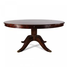 an oval dining table with two leaves on the base