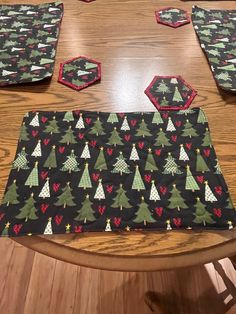 the table is set up with placemats, coasters and napkins to make it look like christmas trees