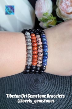 Introducing listing for ONE Tibetan Dzi Gemstone bracelet, for men and women, of your choice. These bracelets are great protection Feng Shui amulets, and would make thoughtful gifts for your loved ones.
All bracelets are made of matte black onyx beads, Dzi bead of your choice, and rondelle gemstones of your choice. #dzimoneyhook #dzibracelet #dzi9eyes #dzi21eyes #dzi2eyes #fengshuiamulet #menbracelet #mengift #menjewelry #menfashion #giftforboyfriend #blackonyx #lapislazuli #redjasper #rhodonite Eyes Boyfriend, 16th Birthday Gifts For Girls, Red Jasper Jewelry, Masculine Jewelry, Red Jasper Bracelet