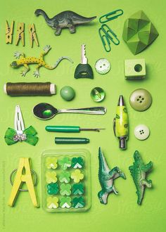 various items are arranged on a green surface