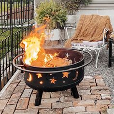 a fire pit sitting on top of a brick patio