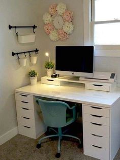 a desk with a computer on top of it