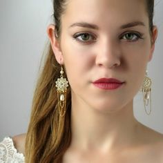 "I created this chandelier wedding earring by hand, using Swarovski pearls and beads 3-5mm, Swarovski pearl drop, Miyuki round seed beads, 14k gold filled chain and ear-wire Feminine, striking and classic * Measurements: Earrings length: 3.34\" (8.5cm) flowers diameter: 0.78\" (2cm) * The earrings will come beautifully packaged for a gift. * For other Bridal earrings: https://www.etsy.com/ca/shop/LioraBJewelry?ref=listing-shop2-all-items-count%C2%A7ion_id&section_id=16552834 * Shop Policies: Earrings Gold Long, Bridal Chandelier Earrings, Statement Bridal Earrings, Bohemian Chandelier, Chandelier Earrings Gold, Bridal Earrings Gold, Chandelier Wedding, Boho Bridal Jewelry, Wedding Earrings Chandelier