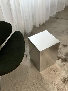 a chair and table in front of a window