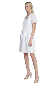 Stay cool and chic in our Catalina dress featuring a v-neck, lace trim, and pockets. This short sleeve, above the knee babydoll style is perfect for summer events or a day at the office! White V-neck Dress With Short Sleeves, Elegant V-neck Dress With Short Sleeves For Daywear, Elegant Short Sleeve V-neck Dress For Daywear, V-neck Lace Trim Day Dress, V-neck Lace Trim Daywear Dresses, V-neck Lace Trim Dress For Daywear, Short Sleeve Dresses With Lace Trim For Daywear, V-neck Dress With Lace Trim For Daywear, V-neck Daywear Dress With Lace Trim