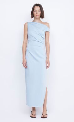 The BEC + BRIDGE Rochelle Asym Midi Dress is an elegant and chic style. The eventwear midi dress features asymmetrical, off the shoulder neckline, tucks at side seams to flatter the silhouette, mid thigh side split, darts for shaping and lining to full length.