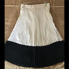 Nwt, Never Worn, Maxi Pleated Skirt. Ivory With Black Bottom Two Tone Skirt. Has Side Long Zipper With Clasp & Has A Slip. % Polyester. Forever 21 White Lined Skirt Bottoms, Forever 21 White Skirted Bottoms, Forever 21 White Flowy Skirt, White Forever 21 Skirt For Day Out, Chic White Forever 21 Skirt, Forever 21 Pleated Flowy Skirt, Forever 21 Pleated Skirt For Day Out, Chic Relaxed Fit Forever 21 Skirt, Two Tone Skirt