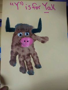 a child's handprint with a cow on it that says yy is for yak