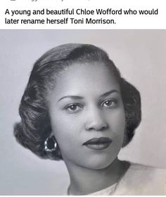 an old black and white photo of a woman with large earrings on her head, looking at the camera