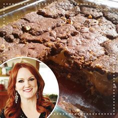 a woman smiling next to a piece of chocolate cake