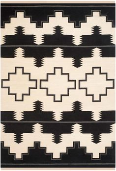 a rug with black and white designs on it