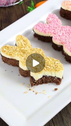 three heart shaped brownies on a plate with sprinkles in the shape of hearts