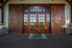 the front entrance to a home with two double doors