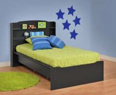 a child's bedroom with blue and green decor