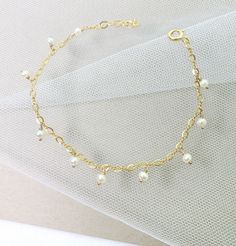 Freshwater Pearl Bracelet ⭐️Pearl: Freshwater Pearl, 2.5-3mm ⭐️Metal: 14K gold filled ⭐️Bracelet Length: you can choose a specific length or adjustable length. 🎁All items will be placed on a card and packed into a jewelry box. It's ready as a Gift. 14K Gold Filled means using 14K gold overlay which is then boned to a brass inner core, it's resulting in durable and quality product. All stone are genuine gemstone, due to the nature of natural gemstone beads, the size and color of the stones may b Gold Charm Bracelet With Adjustable Chain For Wedding, Delicate Gold-plated Bracelet For Wedding, Dainty Hypoallergenic Charm Bracelet For Weddings, Delicate Gold Plated Bracelet For Wedding, Adjustable Gold-plated Charm Bracelet For Wedding, Delicate Gold Charm Bracelet For Wedding, Dainty Gold-plated Bracelet For Wedding, Dainty Gold Plated Bracelet For Wedding, 14k Gold Filled Bracelet For Wedding