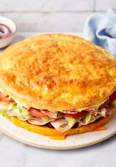 a large sandwich sitting on top of a white plate