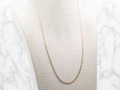 This long 14-karat yellow gold curb link chain is made up of flat, oval, light-reflecting links. Ready to wear alone or with a pendant, this is a great piece for layering!Metal: 14K Yellow GoldWidth: 2.0 mmLength: 24 InchesMarks: "585 14K 3" Stamped on the clasp Curb Chain, Link Chain, Lobster Clasp, Layering, Ready To Wear, Yellow Gold, Chain, Pendant, Yellow