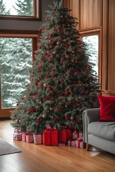 a christmas tree with presents in front of it