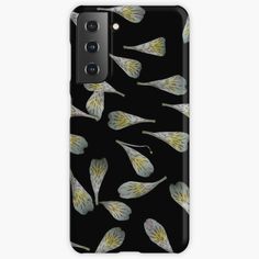 a black phone case with white and yellow flowers on the front, against a dark background